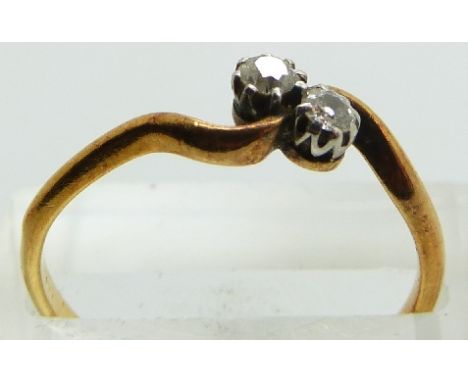 An 18ct gold ring set with two diamonds, 2.3g, size R