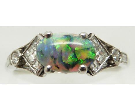 Art Deco platinum ring set with an oval opal cabochon and square, baguette and round cut diamonds, size N, in original box