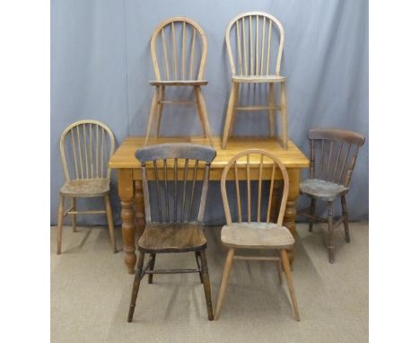 Pine kitchen or dining table, L122 x W77 x H77cm, together with four possibly Ercol hoop back chairs and two Windsor kitchen 