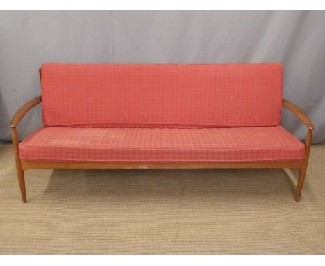 France and Co retro Danish teak sofa with original red geometric design cushions, length 197cm