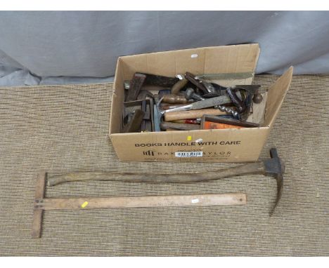 A collection of largely woodworking tools including adze, t-square, chisels etc