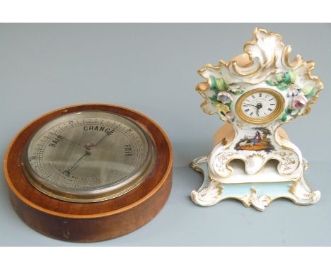 Mahogany and inlaid cased aneroid dial barometer with 17cm diameter silvered dial, together with a 19thC porcelain mantel clo