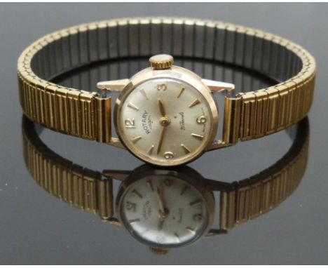 Rotary 9ct gold ladies wristwatch with gold hands and hour markers, silver dial and 21 jewel calibre 2410 movement, on expand