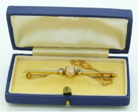 A yellow metal brooch set with an opal cabochon and diamonds with a platinum finish, in vintage box&nbsp;