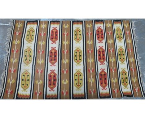 Retro 60's/70's kilim with red and yellow guls on cream ground, 310 x 196cm