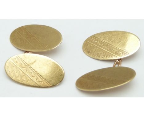 A pair of gold cufflinks with engine turned decoration, 5.1g