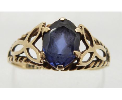 A 9ct gold ring set with an oval cut synthetic sapphire, 1.8g, size R