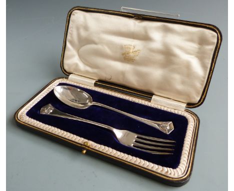 George V hallmarked silver spoon and fork christening set, decorated with winged cherub faces to tops, Sheffield 1910 maker&n