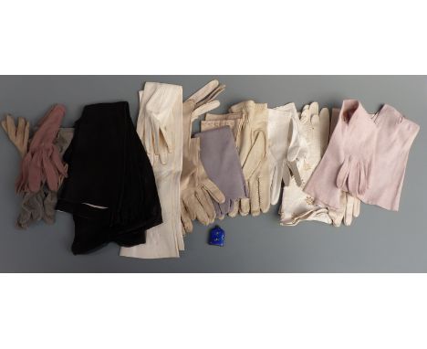 A collection of vintage kid leather and other evening gloves including full length examples together with an enamelled scent 