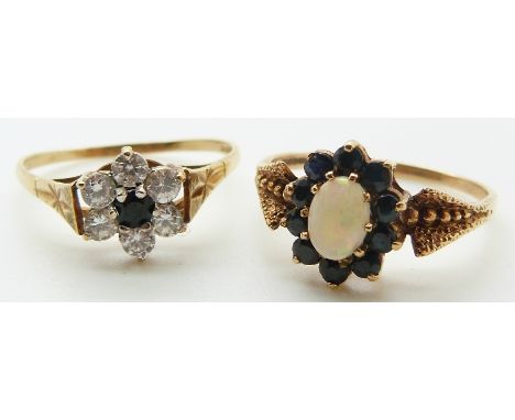 A 9ct gold ring set with an opal cabochon and sapphires and a 9ct gold ring set with a sapphire and paste, 4.9g, size W