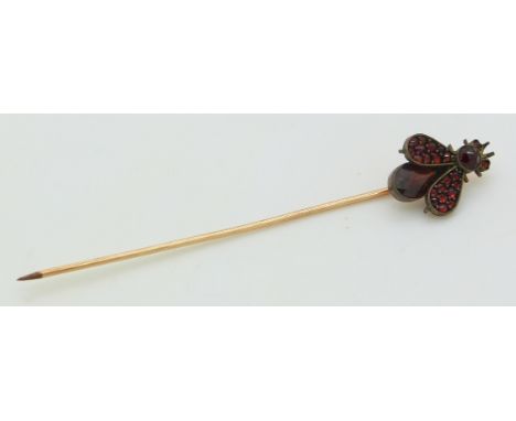 Victorian stick pin in the form of a fly set with Bohemian rose cut garnets