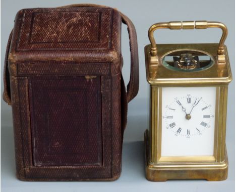 Early 20thC brass carriage clock with corniche style case, the enamel Roman dial with Breguet style hands, movement number 21