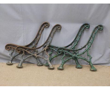 Four matching cast iron garden bench supports of naturalistic twig or branch design