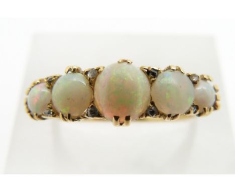 An 18ct gold ring set with opal cabochons and diamonds, 3.5g, size O&nbsp;