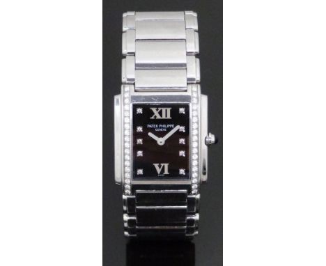 Patek Philippe Twenty-4 ladies wristwatch ref. 4910 with luminous hands, diamond markers, black dial, diamond set stainless s