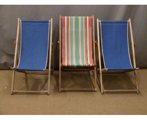 Three vintage deck chairs.