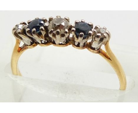 An 18ct gold ring set with three diamonds and two sapphires in a platinum mount, 1.9g, size K&nbsp;