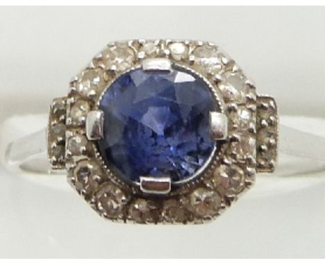 Art Deco platinum ring set with a round cut sapphire measuring approximately 1.8ct surrounded by diamonds, 3.3g, size S