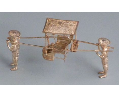 Chinese white metal novelty model of two men carrying a chair with filigree roof and seat, with Chinese silver marks, possibl