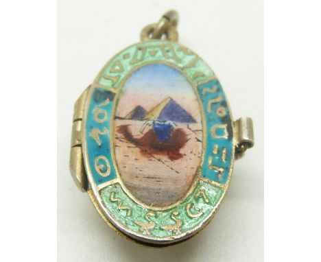 Egyptian Revival charm set with enamel, opening to reveal a baby&nbsp;