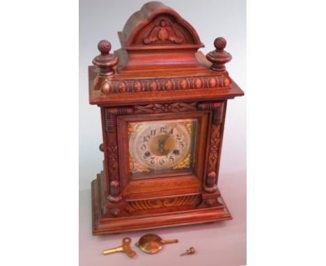 Junghans circa 1930's carved cased mantel/bracket clock, retailer Pleasance and Harper, Bristol to the Arabic chapter ring, t