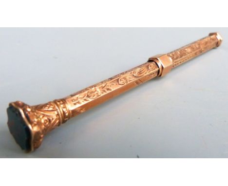 Yellow metal propelling pencil with hardstone finial, marked E.B 9ct, length when extended 13.5cm, weight 18.0g