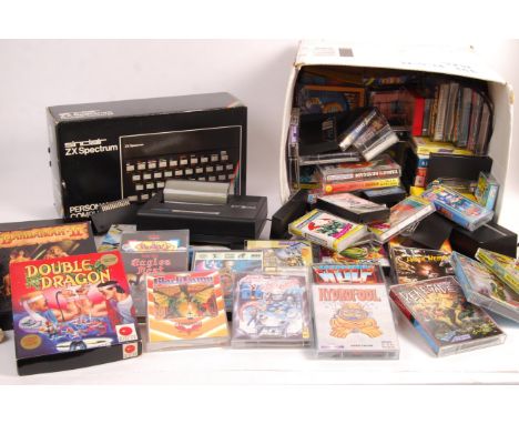 An original vintage Sinclair ZX Spectrum video games computer console along with Timex printer for the zx spectrum and a huge