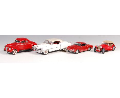 A collection of Franklin Mint scale precision diecast model vehicles to include; 1967 Volkswagen Karmann Ghia, 1953 Cadilac E