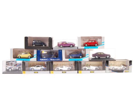 A collection of 12 boxed 1/43 scale diecast models comprising: Minichamps 023000 023001 023002 BMW E1 in three colours, Abrex