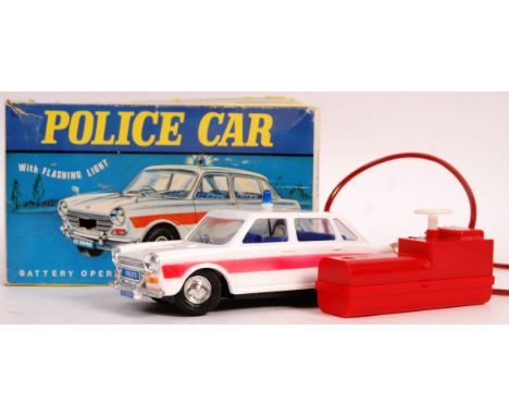 An original vintage Marx Toys battery operated remote control model car HK6159 ' Police Car with Flashing Light ' complete in