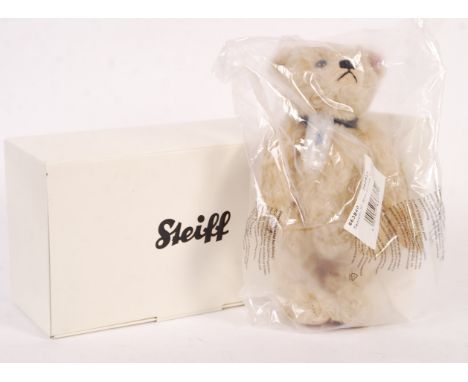 An original 2011 Steiff Princess Diana 50th Birthday bear with growler and necklace. Completely unused in original box still 