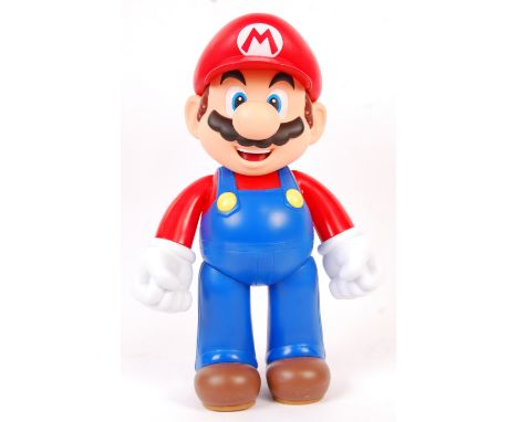 A Nintendo licensed large scale Super Mario Bros ' Mario ' display figure. Unboxed. Features Mario in typical costume, with a