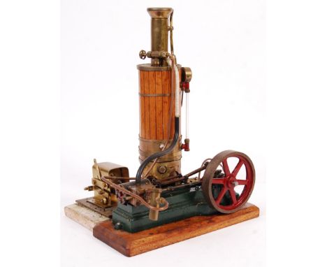 A vintage Stuart Turner made model S50 live steam mill engine. Fitted with a 4" flywheel, and connected to a large unknown-ma