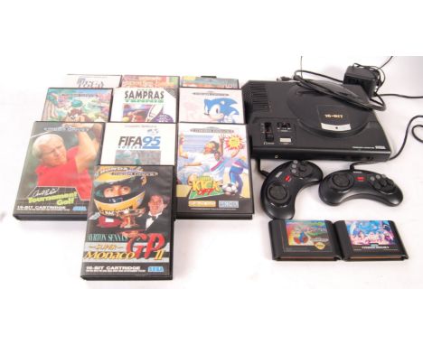 A vintage Sega Mega Drive 16-Bit video games computer console with unofficial aerial &amp; A/C adaptor and 2x official contro