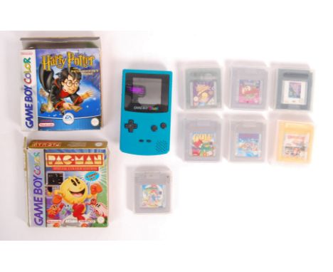 An original vintage Nintendo made Game Boy Colour handheld games console in teal, along with a selection of assorted games ca