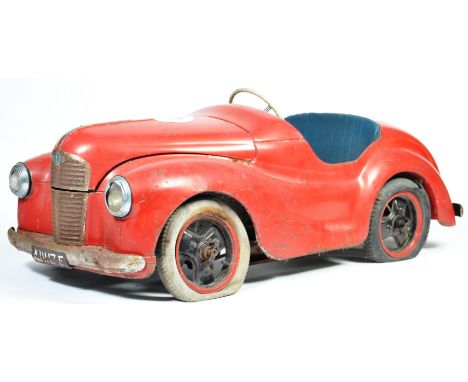 A charming rare vintage 1940's / 1950's ' Austin Junior Forty ' ( J40 ) child's pedal car. In it's original Austin red paint.