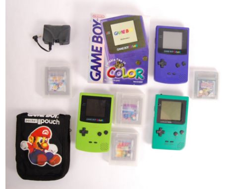 A collection of assorted vintage Nintendo made Game Boy Colour handheld games consoles and games. To include; a boxed Game Bo