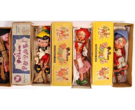 A charming collection of x4 original vintage Pelham Puppets. To include; Noddy (box base only, no lid), Pinocchio, Tyrolean G