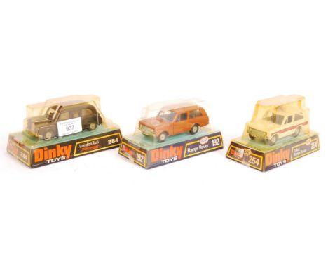 Three original vintage Dinky Toys made boxed diecast models comprising: 284 London Taxi, 192 Range Rover and 254 Police Range