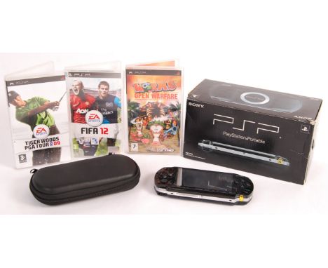 An original Playstation made ' PSP ' Playstation Portable handheld games console - within it's original box, with power lead 