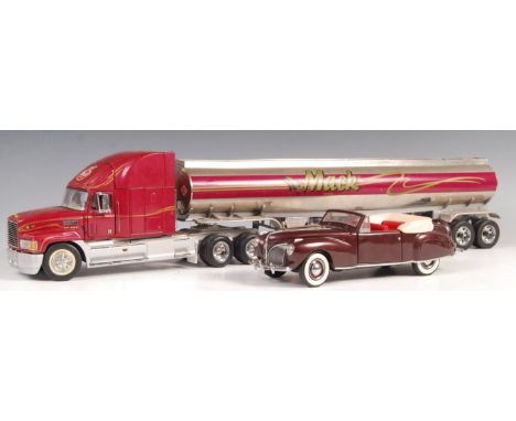 A Franklin Mint scale precision diecast model 1993 Mack &amp; Tanker Trailer along with a Franklin Mint vintage convertible. 