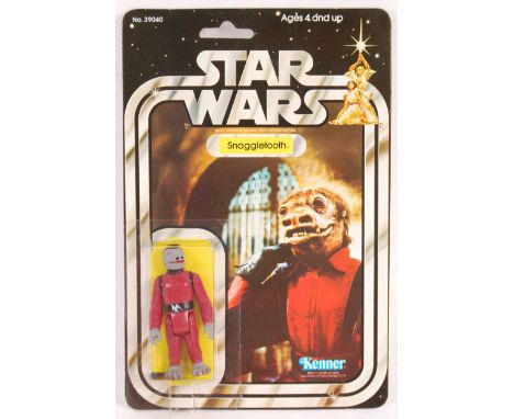 A rare ex-shop stock condition original vintage Kenner made Star Wars MOC carded action figure ' Snaggletooth '. Incredible o