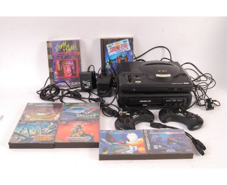 A vintage Sega Mega Drive 16-Bit &amp; Sega Mega CD video computer games console with 2x A/C adaptors, aerial cable, 2x Sega 