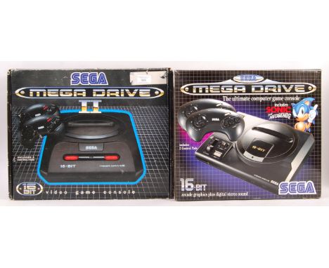A boxed vintage Sega Mega Drive 16-Bit video games computer console with aerial, official A/C adaptor, 2x control pads with S