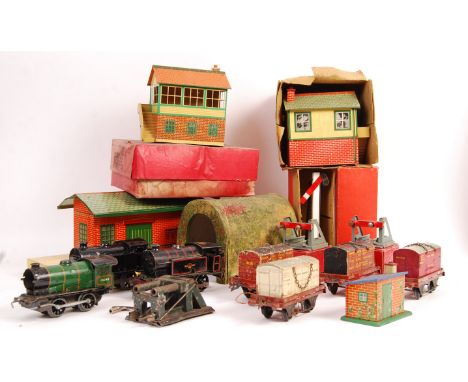 A collection of assorted vintage Hornby Series 0 gauge model railway items - some boxed, to include; x3 clockwork locomotives