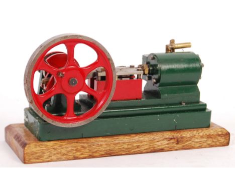 An unknown make Stuart style vintage live steam single cylinder vertical engine. 3.25" diameter flywheel, with green painted 