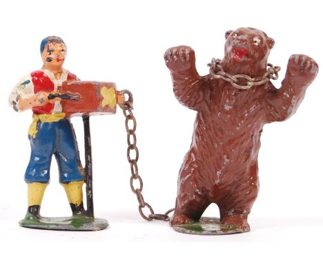 A rare vintage Timpo Toys made lead ' Gypsy Organ Grinder &amp; Dancing Bear ' figures. Complete, including the chain. Faint 