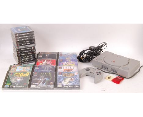 A vintage PS1 PlayStation video computer games console complete with official aerial cable, official A/C adaptor, 2x memory c