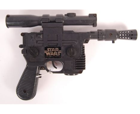 An original vintage Kenner made ' Han Solo Blaster ' battery operated pistol. Complete, including both battery compartment lu