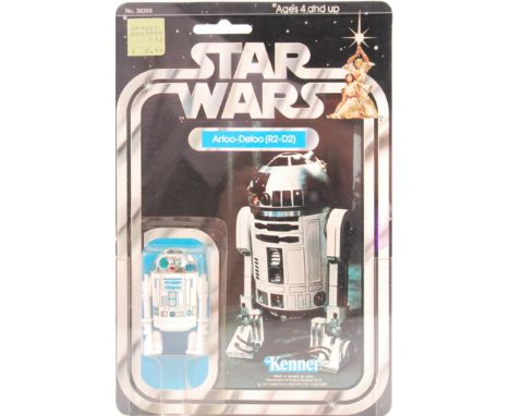 A rare vintage ex-shop stock Kenner made Star Wars carded MOC action figure ' Artoo-Detoo ( R2-D2 ) '. AFA Graded (85 - C85, 